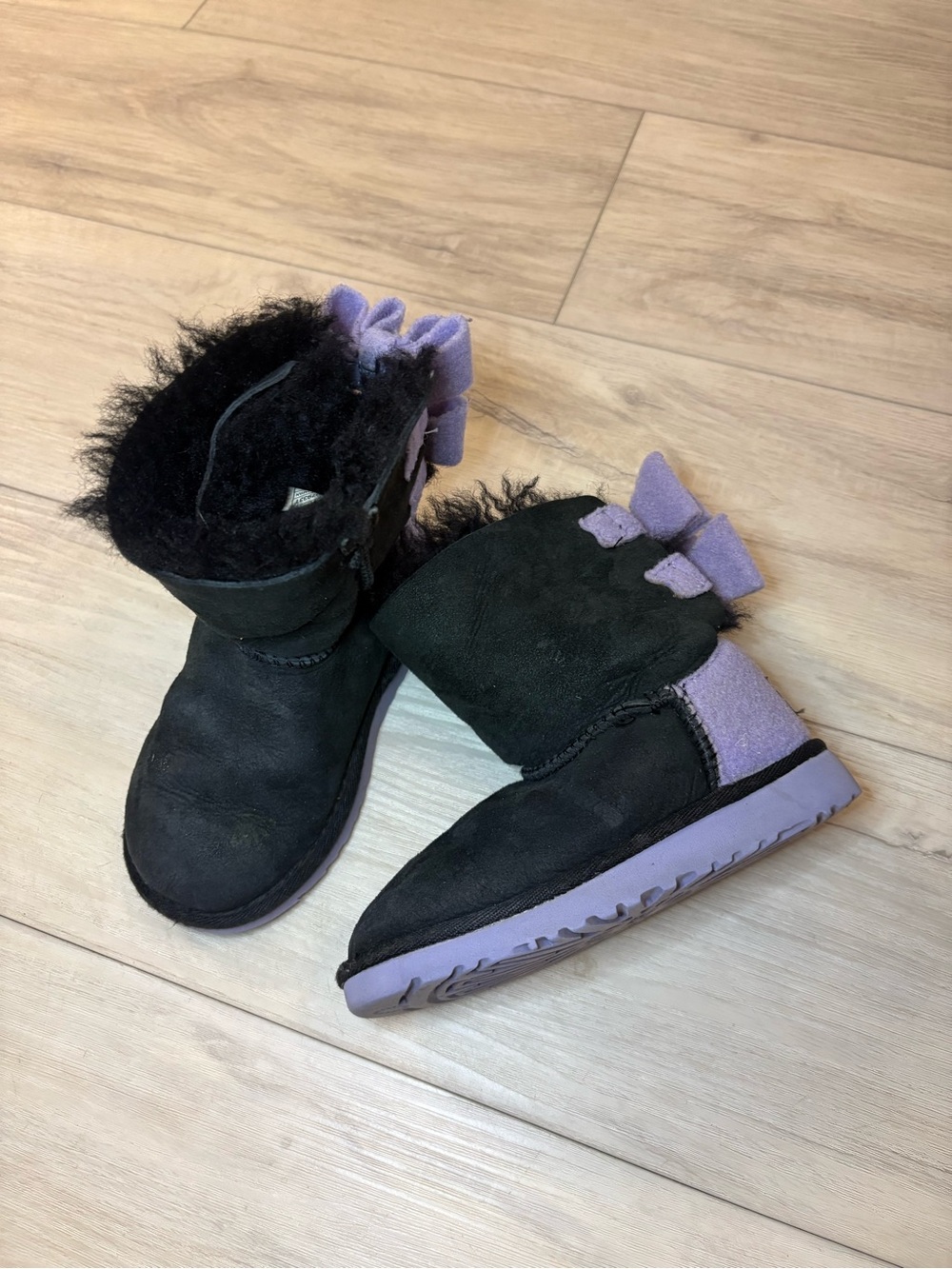 UGG Kids Black and Lavender Bow Shearling Boots
